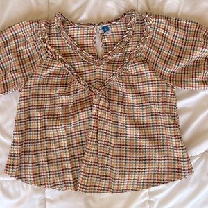 Checkered colorful blouse.